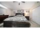 Comfortable main bedroom with dark wood furniture, light wood floors and closet at 670 42Nd Ne Ave, St Petersburg, FL 33703