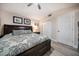 Comfortable main bedroom with dark wood furniture, light wood floors and closet at 670 42Nd Ne Ave, St Petersburg, FL 33703