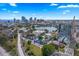 Extensive aerial view with city skyline and lake in the distance, with buildings nearby at 701 Mirror Lake N Dr # 103, St Petersburg, FL 33701