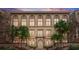 Beautiful historic building with many windows, palm trees, and elegant architectural details at 701 Mirror Lake N Dr # 103, St Petersburg, FL 33701