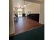 Inviting hallway with decorative flooring, dark wood wainscoting, vintage bench, and bright entrance at 701 Mirror Lake N Dr # 103, St Petersburg, FL 33701