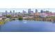 Scenic aerial view of a lake with a fountain and a city skyline in the background on a sunny day at 701 Mirror Lake N Dr # 103, St Petersburg, FL 33701