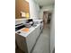 Community laundry room, equipped with rows of large capacity washers and dryers at 701 Mirror Lake N Dr # 103, St Petersburg, FL 33701