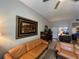 Bright living area with comfortable seating, tile flooring, and decorative artwork at 701 Mirror Lake N Dr # 103, St Petersburg, FL 33701
