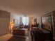 Bright living room with a ceiling fan, comfortable seating, and a beautiful view at 701 Mirror Lake N Dr # 103, St Petersburg, FL 33701