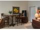 Open living area with bar-height seating and a view of the doorway to the kitchen at 701 Mirror Lake N Dr # 103, St Petersburg, FL 33701