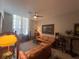 Spacious living room with tile floors, stylish furniture, and abundant natural light at 701 Mirror Lake N Dr # 103, St Petersburg, FL 33701
