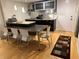 Modern kitchen features stainless steel appliances, granite countertops, and an island with seating at 701 S Madison Ave # 410, Clearwater, FL 33756