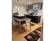 Eat-in kitchen with modern cabinetry, stainless steel appliances, and wood floors at 701 S Madison Ave # 410, Clearwater, FL 33756