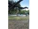Outdoor pool area featuring a metal fence, and gazebo in the background at 701 S Madison Ave # 410, Clearwater, FL 33756