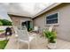 Outdoor living space with wood deck featuring decorative patio furniture, landscaping, and home's exterior at 755 Green Valley Rd, Palm Harbor, FL 34683