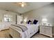 Bedroom with white furniture, complemented by light-colored walls and hardwood floors at 755 Green Valley Rd, Palm Harbor, FL 34683