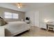 Cozy bedroom with ceiling fan, light wood floors, and white furniture at 755 Green Valley Rd, Palm Harbor, FL 34683