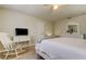 Bedroom featuring white furniture, complemented by light-colored walls and hardwood floors at 755 Green Valley Rd, Palm Harbor, FL 34683