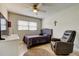 Cozy bedroom featuring a comfortable bed, recliner chair, and stylish decor at 755 Green Valley Rd, Palm Harbor, FL 34683