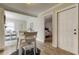 Cozy dining area with white table set and views to the bedroom at 755 Green Valley Rd, Palm Harbor, FL 34683