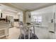 Open concept kitchen and dining area with view to the kitchen at 755 Green Valley Rd, Palm Harbor, FL 34683