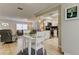 Dining area offering a view of the living room and updated kitchen at 755 Green Valley Rd, Palm Harbor, FL 34683