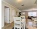 Inviting dining area with natural light streaming in, view to the living room at 755 Green Valley Rd, Palm Harbor, FL 34683