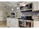 Bright kitchen featuring stainless steel appliances, granite countertops, and open layout at 755 Green Valley Rd, Palm Harbor, FL 34683
