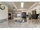 Stylish kitchen with granite countertops and stainless steel appliances with a view to the living room at 755 Green Valley Rd, Palm Harbor, FL 34683