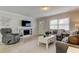 Cozy living room boasting a fireplace, hardwood floors, neutral walls, and comfortable seating at 755 Green Valley Rd, Palm Harbor, FL 34683