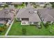 Aerial view of the property showcasing its lush backyard with a patio and manicured lawn at 808 Vittorio Pl, Brandon, FL 33511