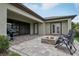 Spacious back patio with grill and outdoor seating around a stone fire pit at 808 Vittorio Pl, Brandon, FL 33511