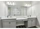 Bright bathroom features double vanity with modern fixtures and large mirror reflecting the shower at 808 Vittorio Pl, Brandon, FL 33511