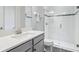 Modern bathroom featuring a glass-enclosed shower, sleek hardware, and bright natural light at 808 Vittorio Pl, Brandon, FL 33511