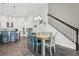 Open dining area with wood table, seating for six, and easy access to the kitchen and staircase at 808 Vittorio Pl, Brandon, FL 33511