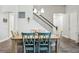Charming dining room with rustic table, decorative chandelier, and staircase access at 808 Vittorio Pl, Brandon, FL 33511