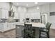 Modern kitchen with white cabinets, stainless steel appliances, and a stylish island at 808 Vittorio Pl, Brandon, FL 33511