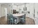 Spacious kitchen island with seating, white countertops, and ample storage perfect for meal prep and casual dining at 808 Vittorio Pl, Brandon, FL 33511