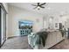 Comfortable living room featuring a ceiling fan, large sectional sofa, and a large TV at 808 Vittorio Pl, Brandon, FL 33511