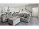 Comfortable living room features a large sectional sofa with great views into the kitchen at 808 Vittorio Pl, Brandon, FL 33511