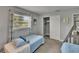 Bedroom with one twin bed, closet, window, and carpet at 8222 Valrie Ln, Riverview, FL 33569