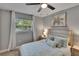 Bright bedroom with a comfortable bed, ceiling fan, and natural light from the window at 8222 Valrie Ln, Riverview, FL 33569