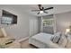 Bedroom with a ceiling fan, a window, a dresser, and a closet at 8222 Valrie Ln, Riverview, FL 33569