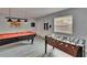 Game room featuring a pool table, foosball table, and a large window at 8222 Valrie Ln, Riverview, FL 33569
