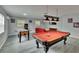 Large game room featuring a pool table, foosball, and fun games at 8222 Valrie Ln, Riverview, FL 33569