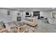 Open-concept living space with modern decor, a brick fireplace, and a breakfast bar at 8222 Valrie Ln, Riverview, FL 33569