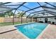 Inviting screened pool area with ample sunlight and brick-paved decking, perfect for summer days at 8222 Valrie Ln, Riverview, FL 33569