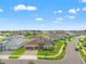 Wide aerial shot displaying the home within a neighborhood with pristine landscaping at 8752 Loft Pt, Wesley Chapel, FL 33545