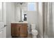 Bathroom featuring wood vanity, updated fixtures, and natural light at 8752 Loft Pt, Wesley Chapel, FL 33545