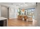Beautiful dining room with elegant wall trim and a view of the pool and outdoor area at 8752 Loft Pt, Wesley Chapel, FL 33545