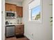 The kitchenette includes a mini-refrigerator, sink and microwave in a bright space at 8752 Loft Pt, Wesley Chapel, FL 33545