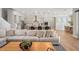 Open living space seamlessly connects to a modern kitchen and dining area, perfect for gatherings at 8752 Loft Pt, Wesley Chapel, FL 33545