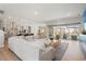Bright living space with a kitchen and pool view, complete with comfortable seating at 8752 Loft Pt, Wesley Chapel, FL 33545
