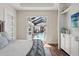 The main bedroom has stylish, walk-out access to the pool and screen patio area at 8752 Loft Pt, Wesley Chapel, FL 33545